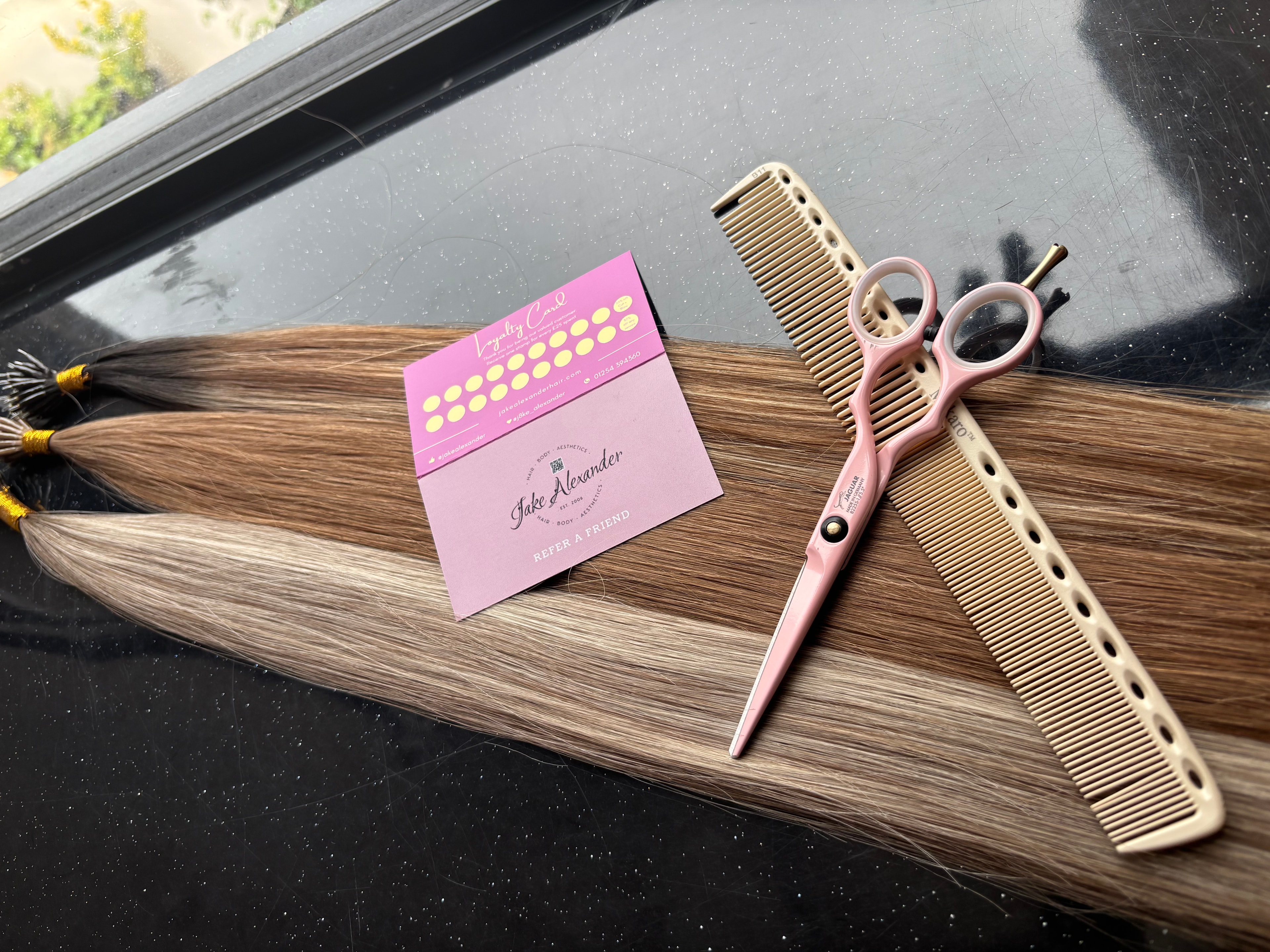 Jake Alexander hair extension wefts, scissors and loyalty card