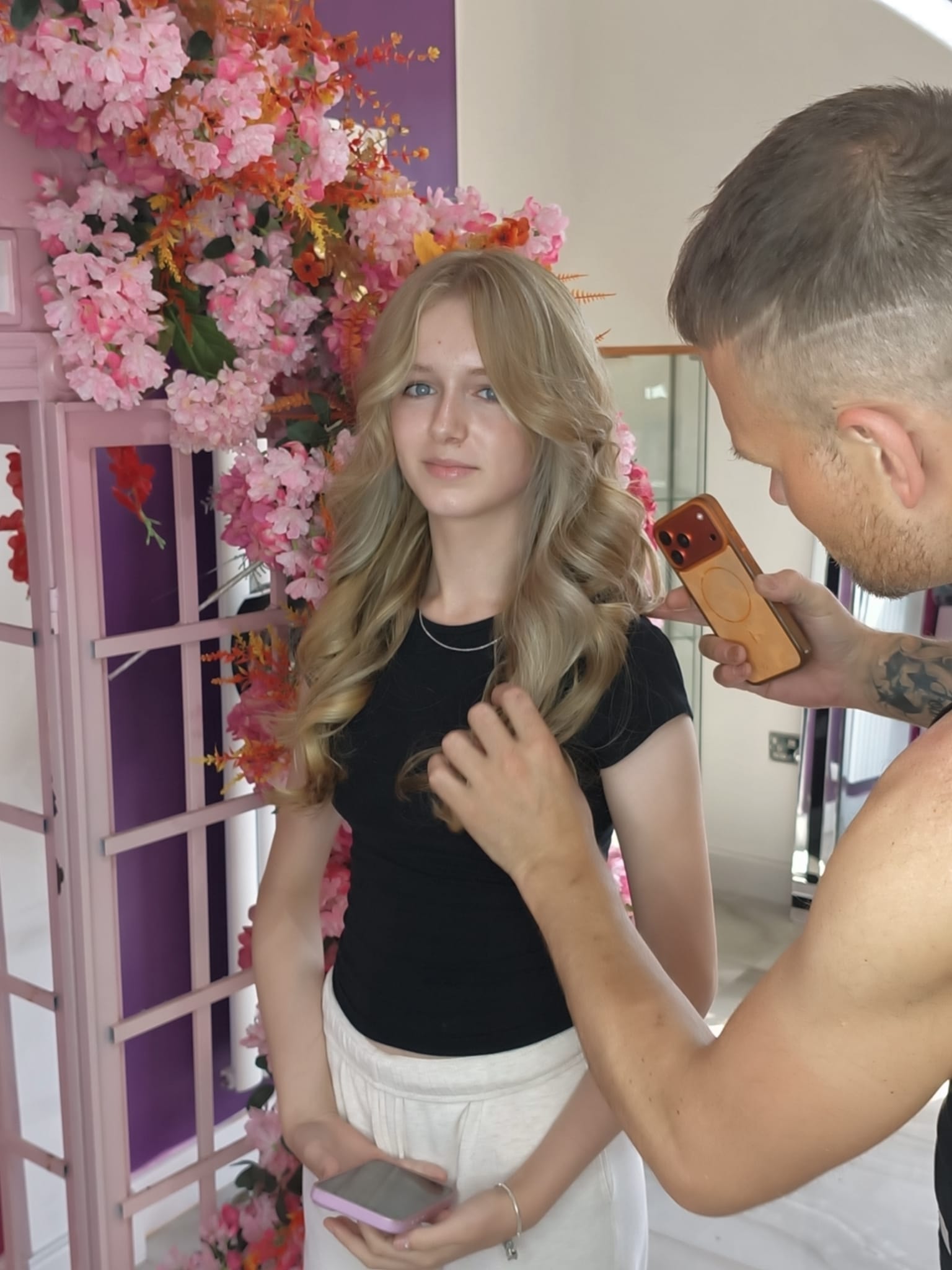 Hair transformation — stylist finishing soft blonde waves