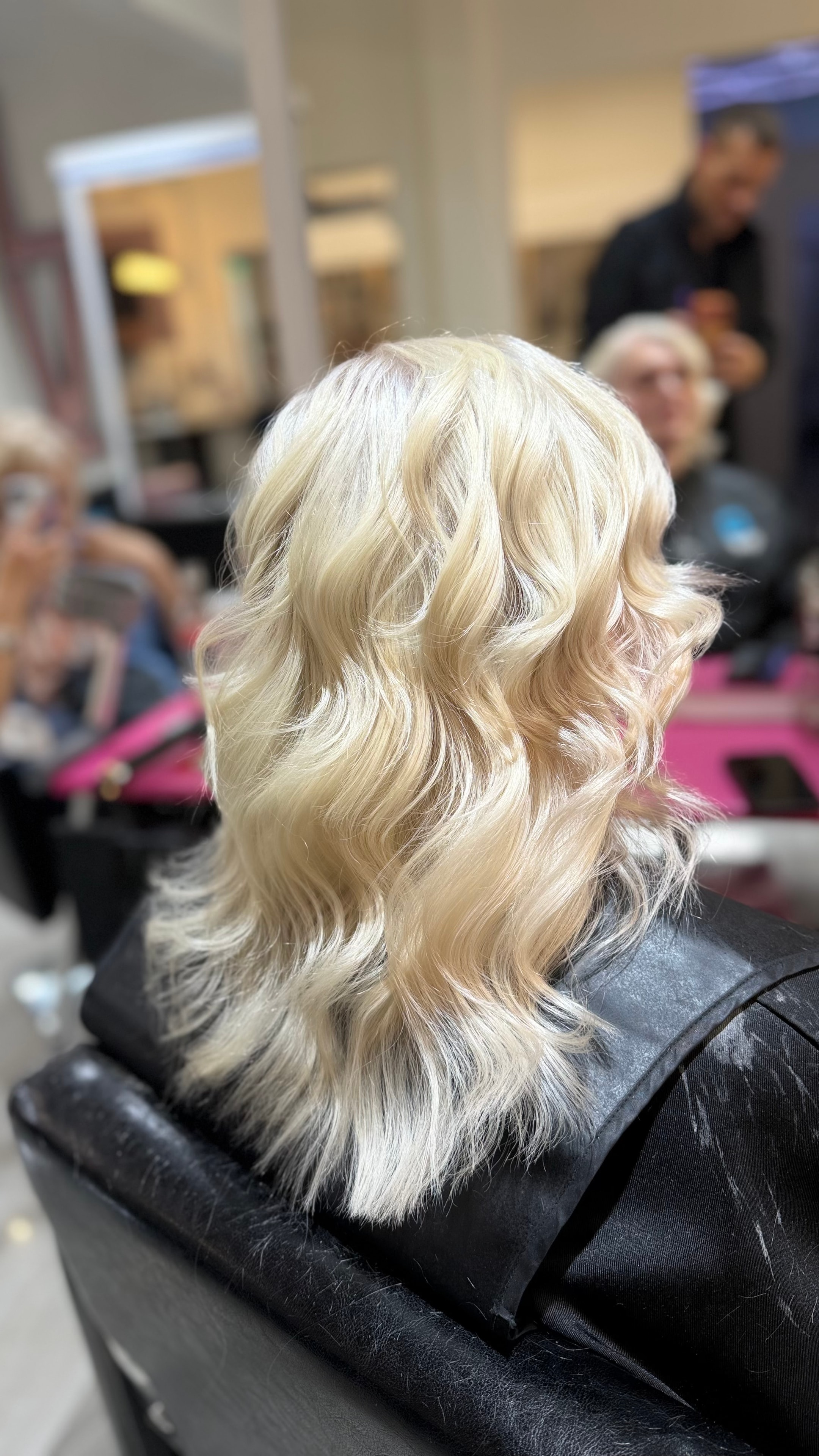 Hair transformation — soft blonde curls in the salon